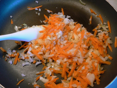 Saute onions and carrots for fried spring rolls recipe